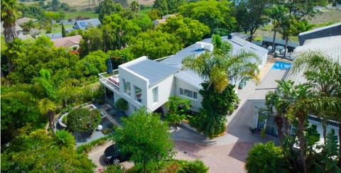 Bird's-eye view of the guesthouse, garden and pool